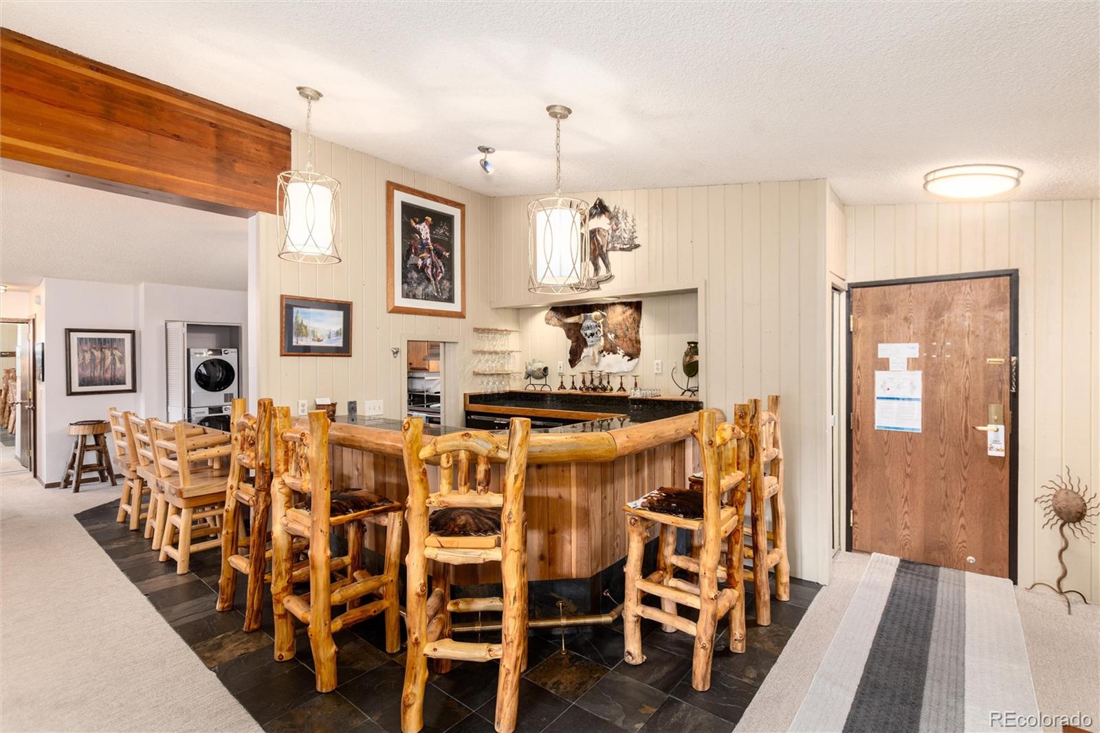 490 Kings Crossing Road, Unit 631633 Winter Park, CO 80482 - Photo 12 of 43 a view of a dining room with furniture and wooden floor