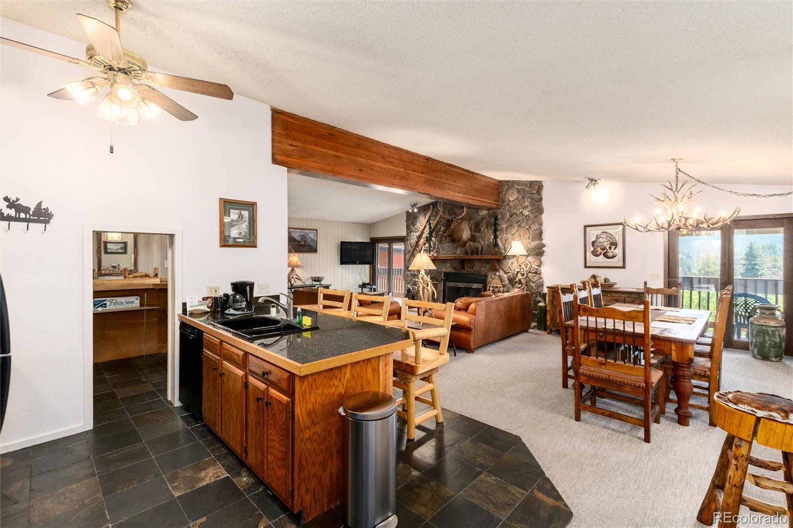 490 Kings Crossing Road, Unit 631633 Winter Park, CO 80482 - Photo 19 of 43 a living room with furniture and a table
