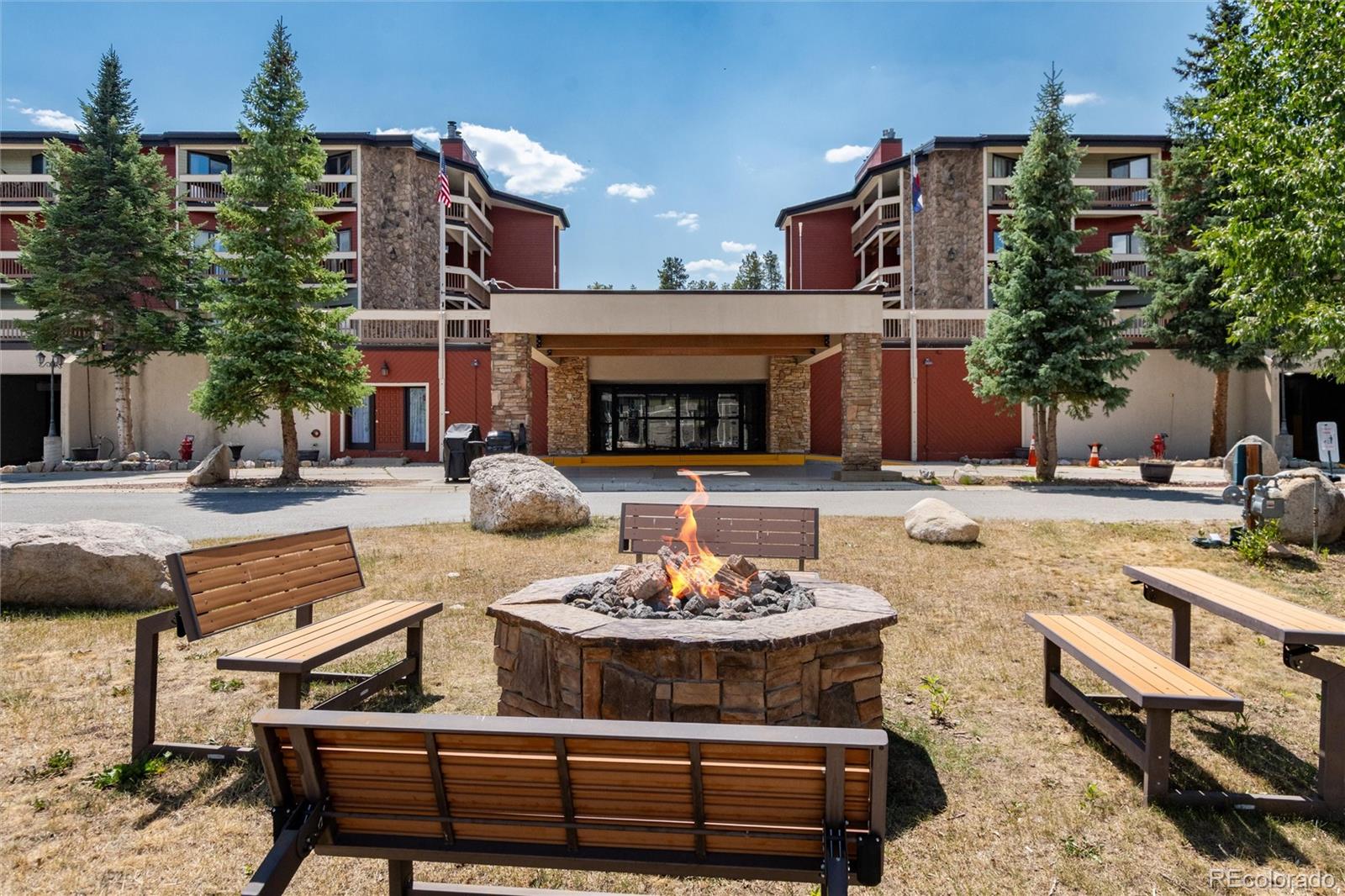 490 Kings Crossing Road, Unit 631633 Winter Park, CO 80482 - Photo 2 of 43 a building outdoor space with patio furniture and a fireplace