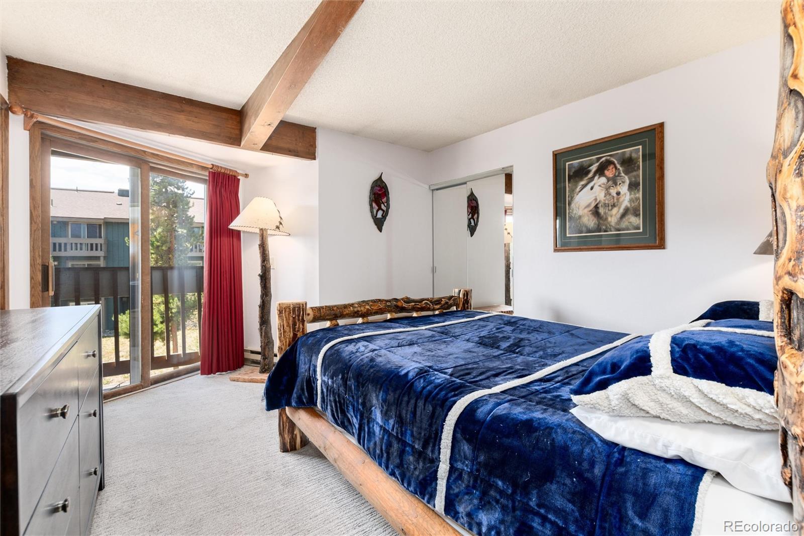 490 Kings Crossing Road, Unit 631633 Winter Park, CO 80482 - Photo 22 of 43 a bedroom with two beds and a large window
