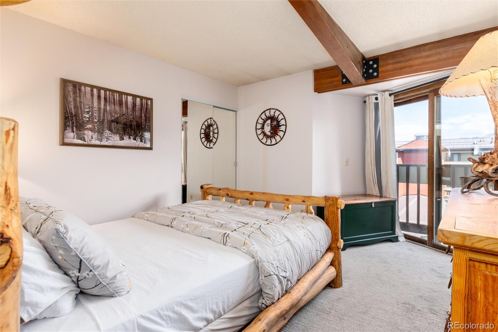 490 Kings Crossing Road, Unit 631633 Winter Park, CO 80482 - Photo 29 of 43 a bedroom with a large bed and a window