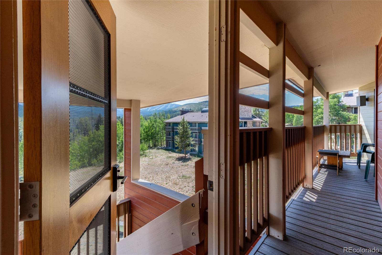 490 Kings Crossing Road, Unit 631633 Winter Park, CO 80482 - Photo 3 of 43 a view of a balcony with wooden floor and furniture