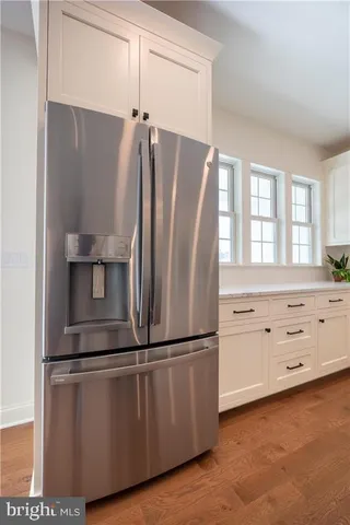 a kitchen with cabinets and stainless steel appliances