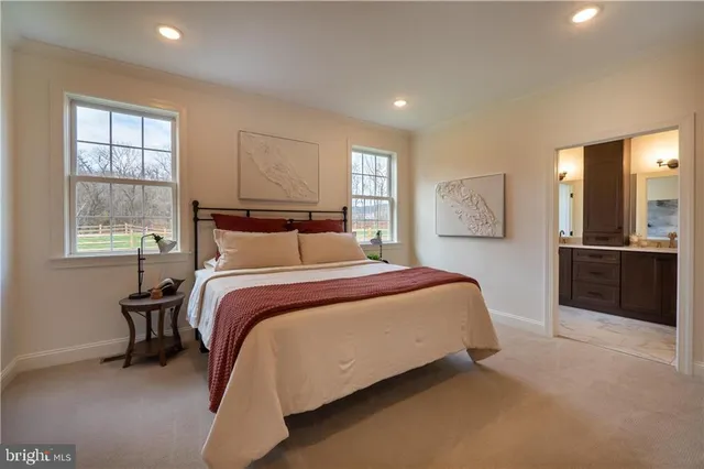 a bedroom with a bed and a lamp