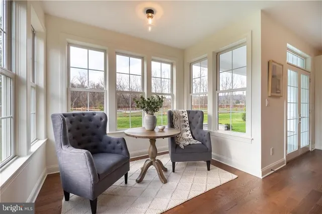 a living room with furniture and a window with outer view