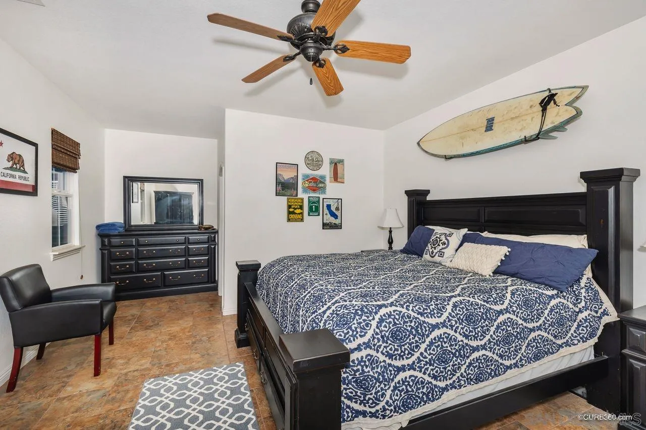 16029 Cayenne Ridge Road San Diego, CA 92127 - Photo 29 of 37 a bedroom with a bed and wooden floor