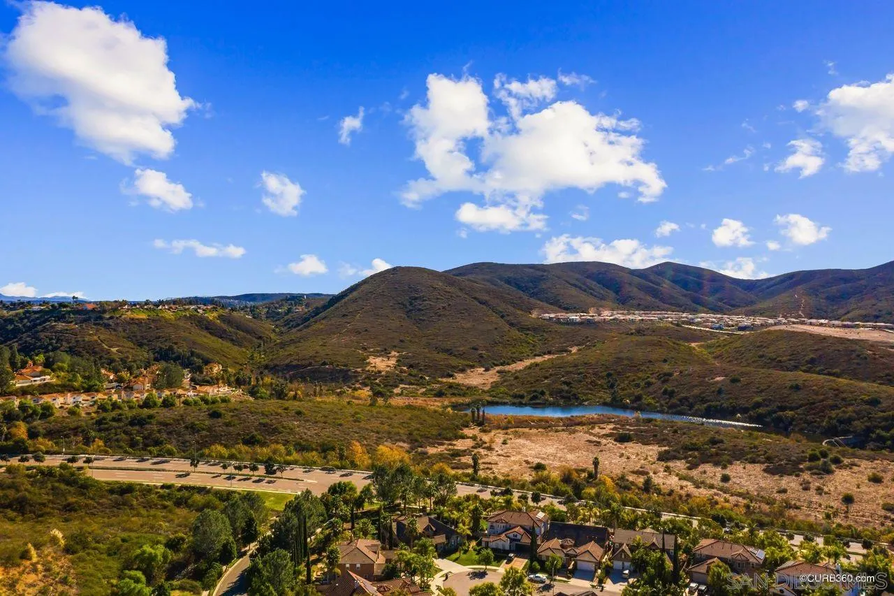 16029 Cayenne Ridge Road San Diego, CA 92127 - Photo 31 of 37 a view of a lake with mountains in the background