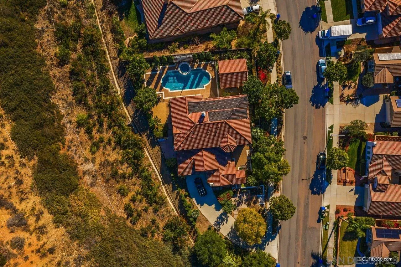 16029 Cayenne Ridge Road San Diego, CA 92127 - Photo 36 of 37 an aerial view of a house with a yard and trees
