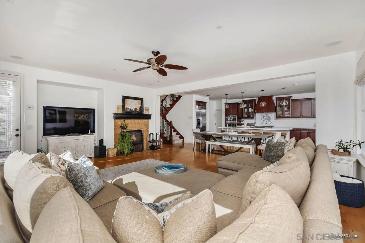 16029 Cayenne Ridge Road San Diego, CA 92127 - Photo 10 of 37 a living room with furniture kitchen view and a flat screen tv