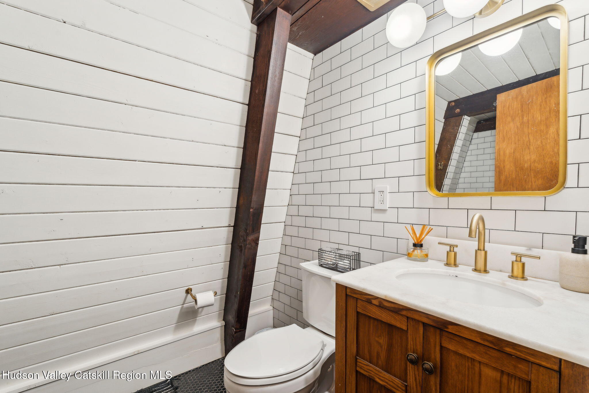 425 North Lake Road Haines Falls, NY 12436 - Photo 19 of 45 a bathroom with a toilet a sink and mirror