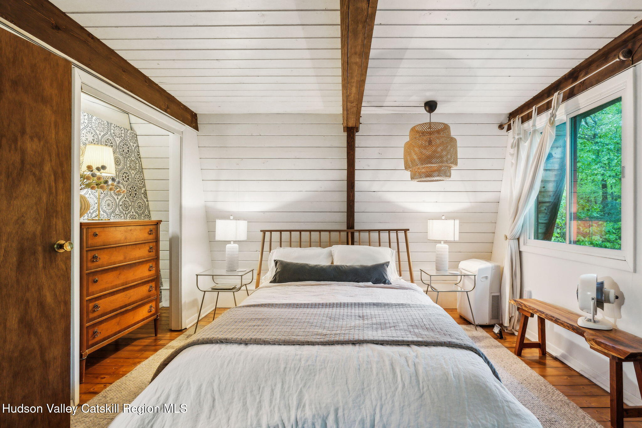 425 North Lake Road Haines Falls, NY 12436 - Photo 21 of 45 a bedroom with a bed and a large window