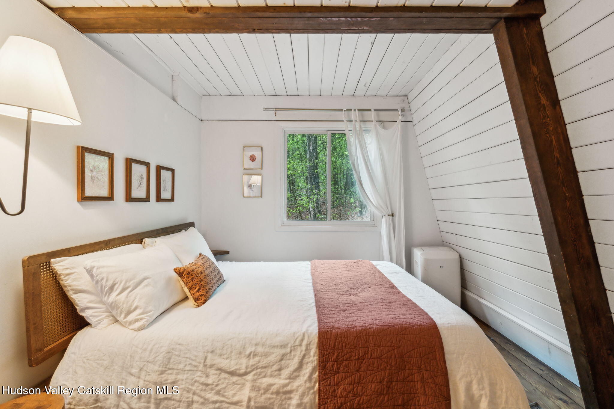 425 North Lake Road Haines Falls, NY 12436 - Photo 27 of 45 a bedroom with a bed and a window