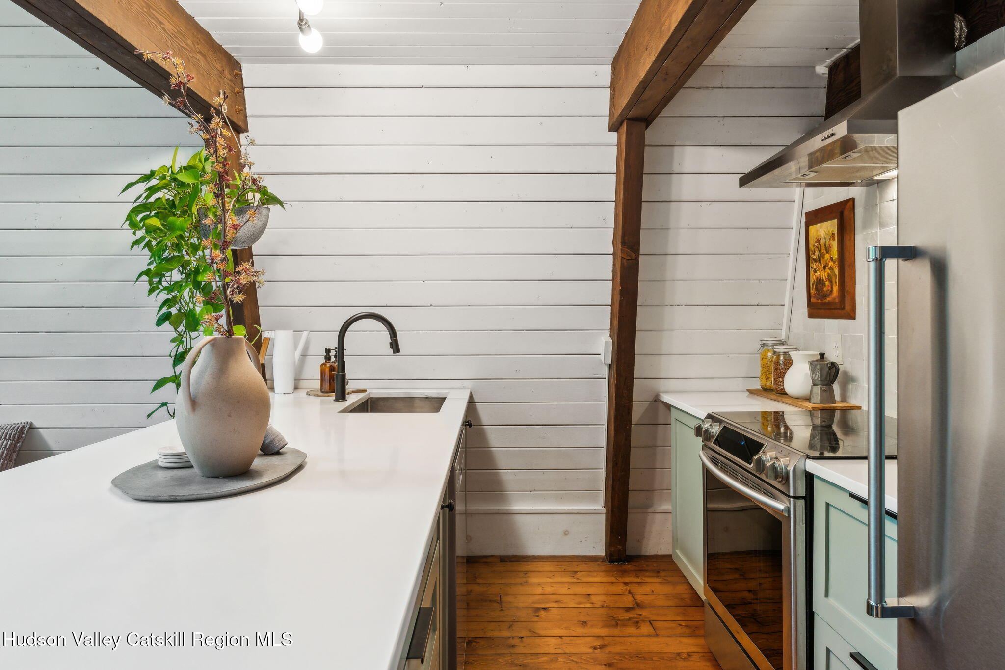 425 North Lake Road Haines Falls, NY 12436 - Photo 8 of 45 a kitchen with a sink and a stove top oven