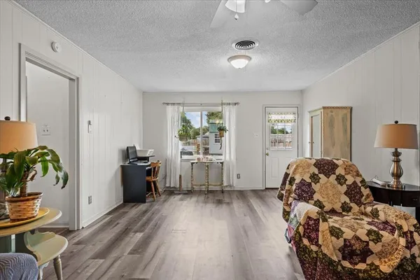 a living room with furniture and a window