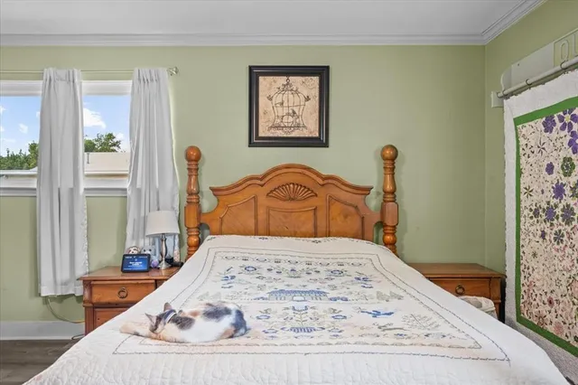 a bedroom with bed and window