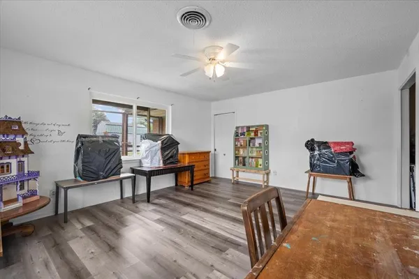 a view of a livingroom with furniture and a workspace