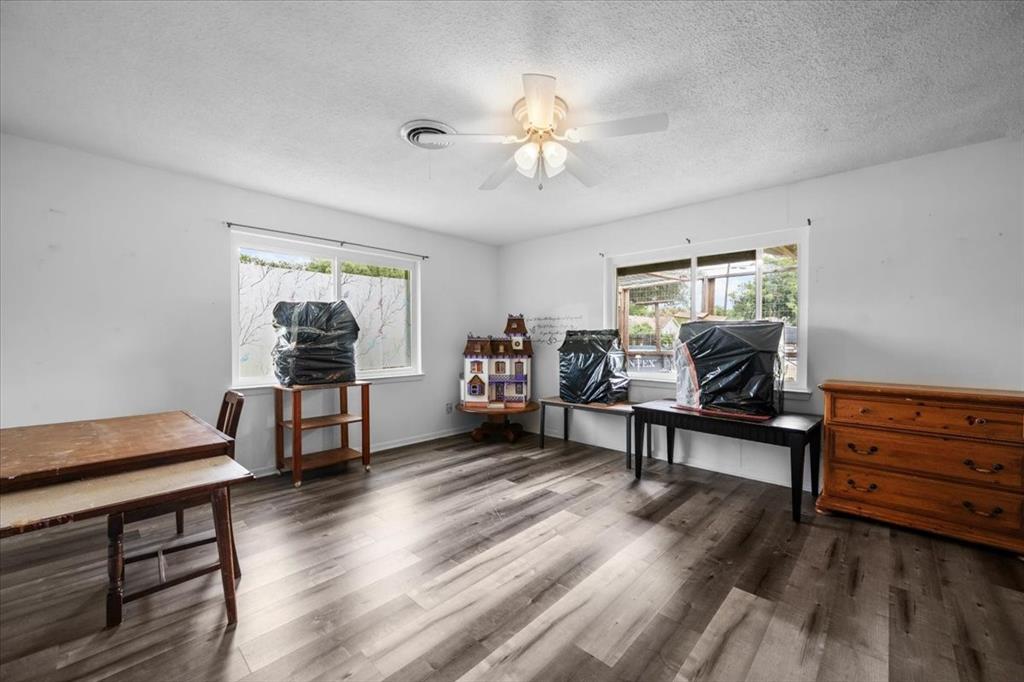 203 Main Street Rosebud, TX 76570 - Photo 26 of 35 a living room with furniture and a wooden floor