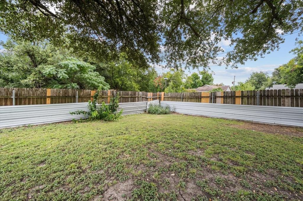 203 Main Street Rosebud, TX 76570 - Photo 29 of 35 a view of garden with deck and trees