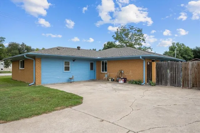a view of garden with deck and trees