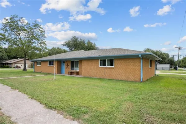 a view of a swimming pool with an outdoor seating and a garden