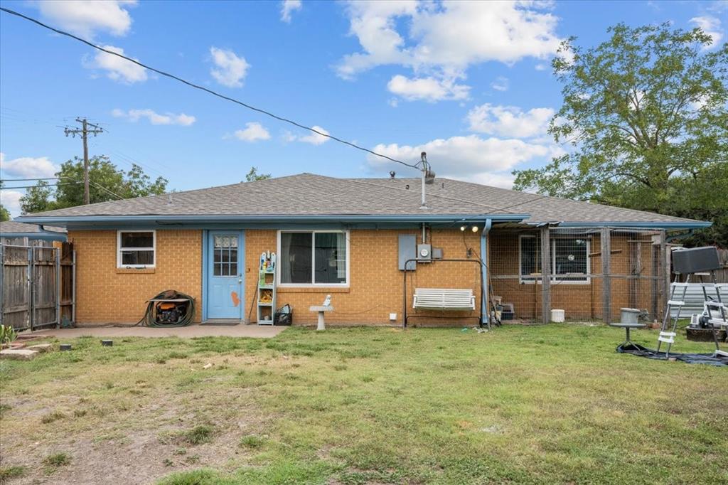 203 Main Street Rosebud, TX 76570 - Photo 34 of 35 a front view of house with yard and seating area