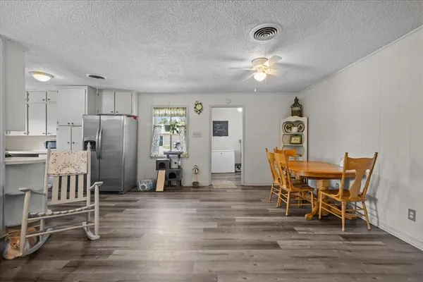 a kitchen with stainless steel appliances white cabinets and a stove a sink