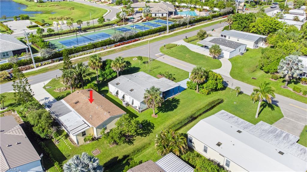 903 Manatee Road Naples, FL 34114 - Photo 28 of 29 an aerial view of a house with a swimming pool yard and mountain view in back