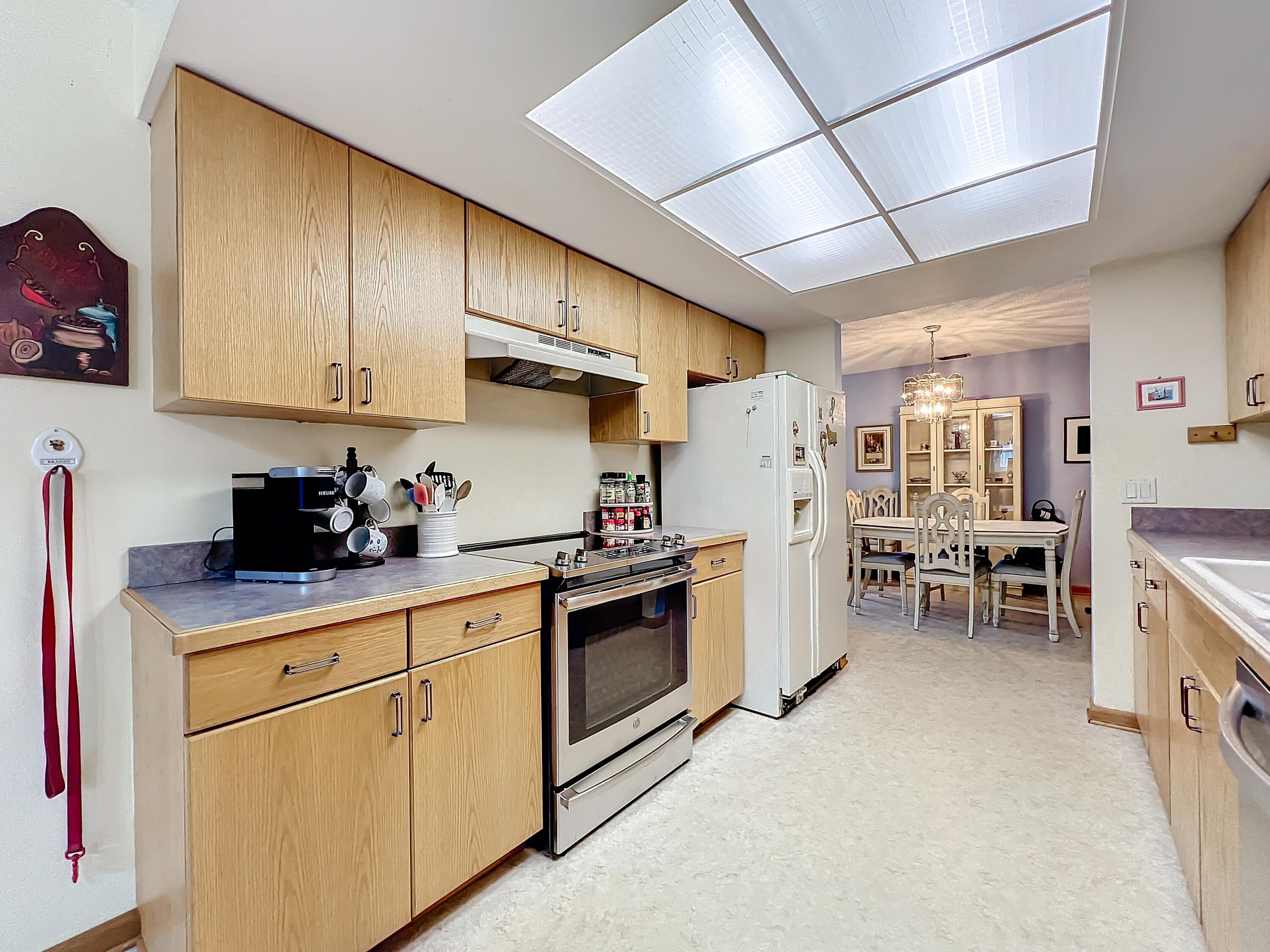 502 Circle East Jupiter, FL 33458 - Photo 16 of 55 a kitchen with cabinets and chairs