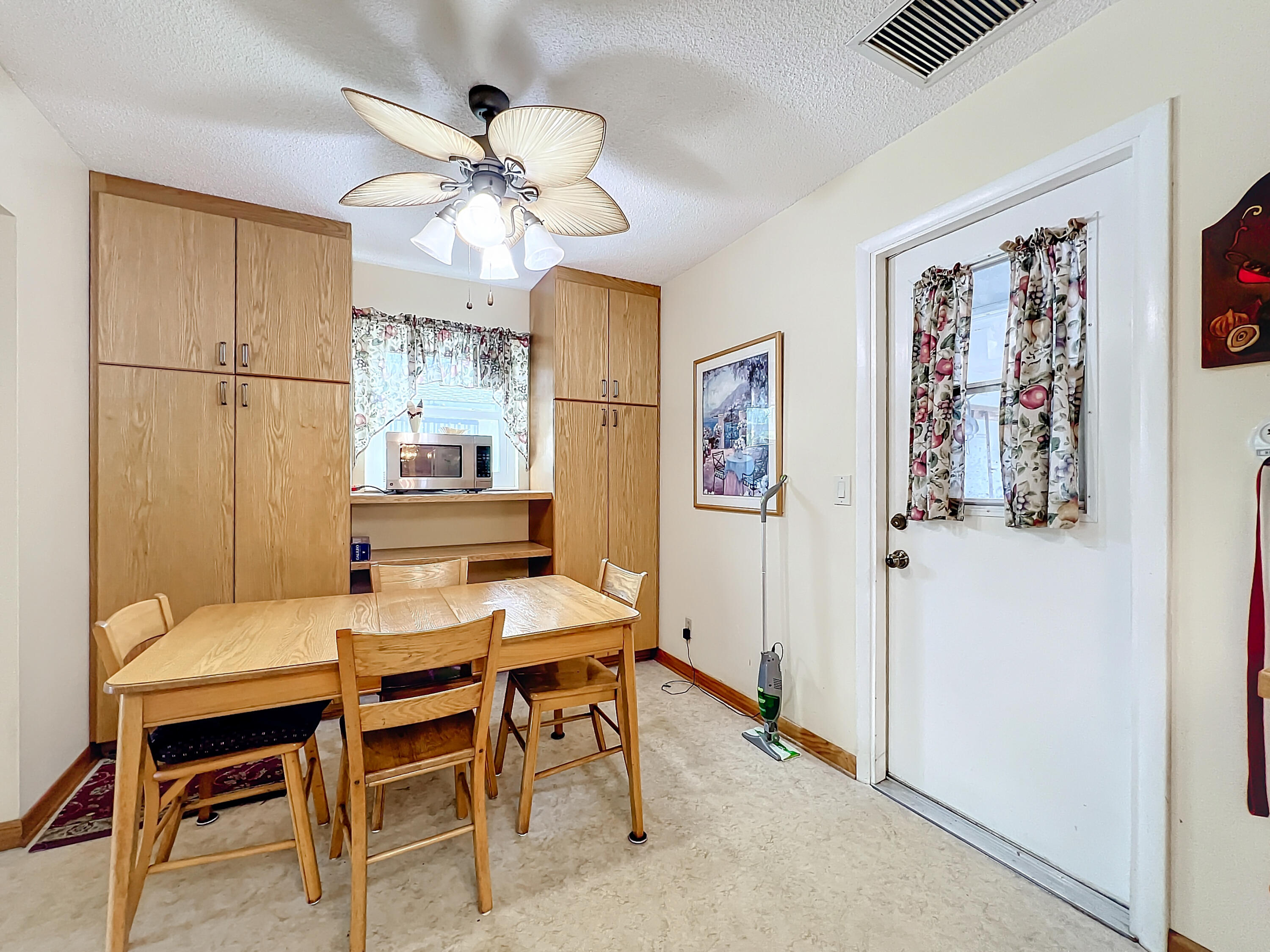 502 Circle East Jupiter, FL 33458 - Photo 19 of 55 a dining room with furniture and window