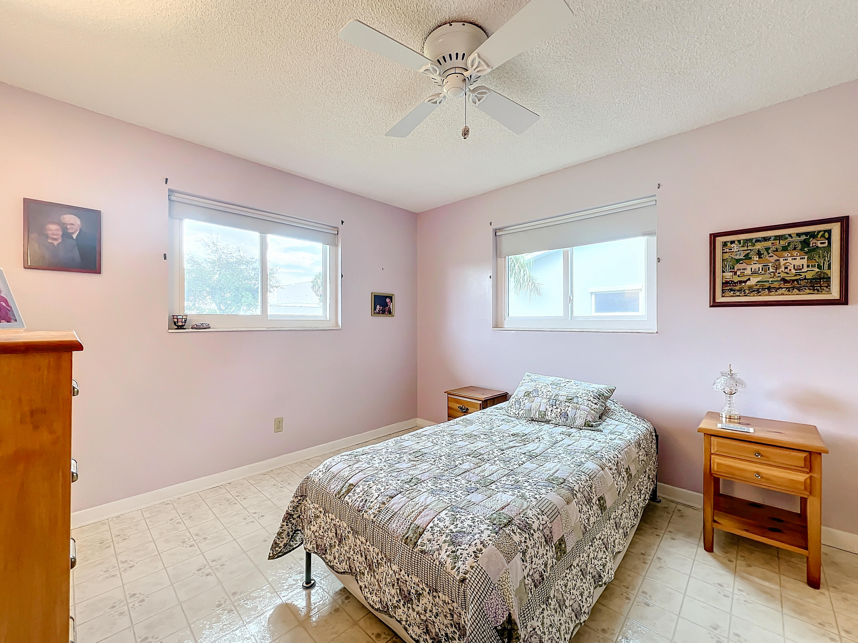 502 Circle East Jupiter, FL 33458 - Photo 30 of 55 a bedroom with a bed and a dresser