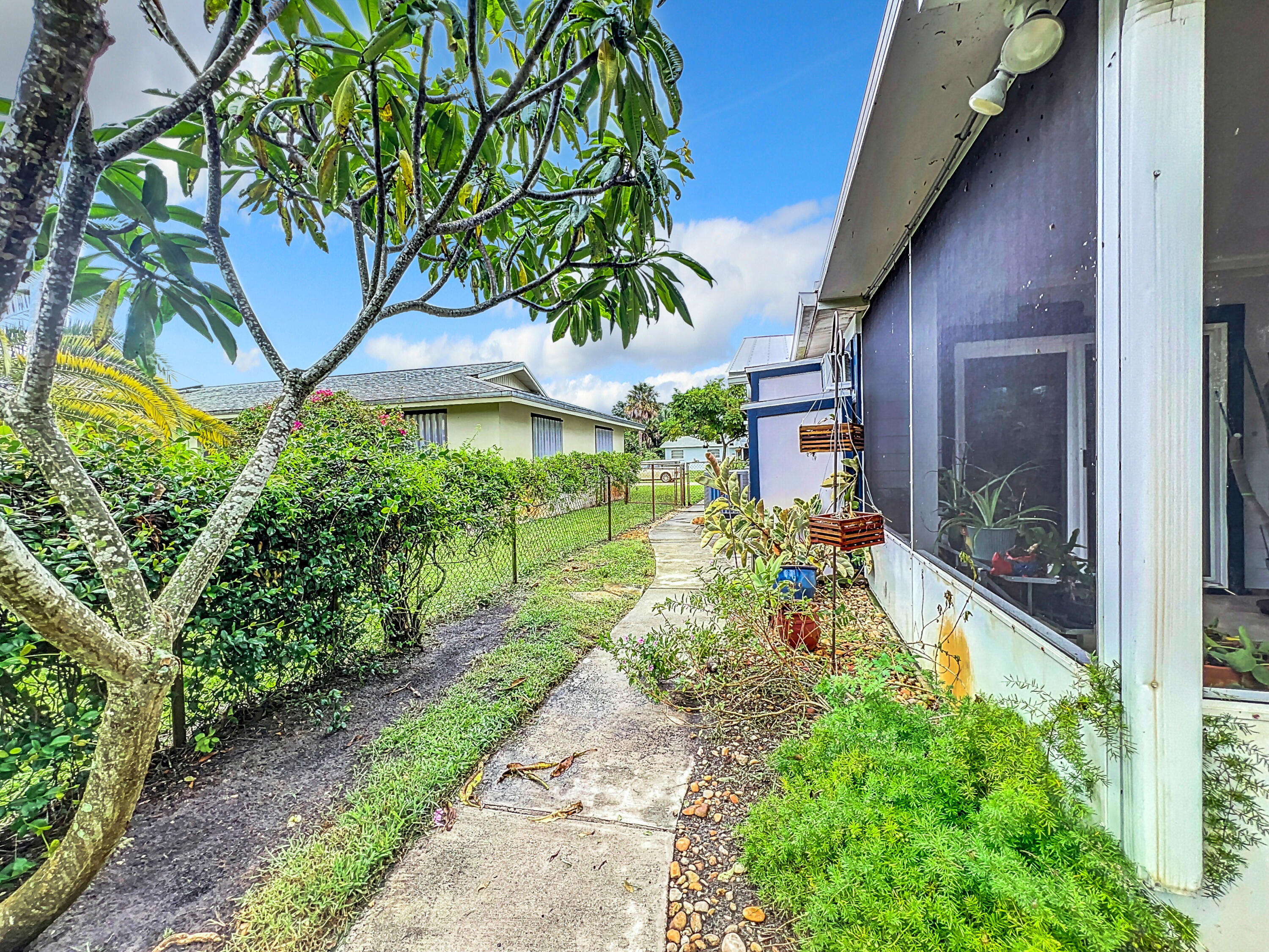 502 Circle East Jupiter, FL 33458 - Photo 50 of 55 a front view of a house with a yard