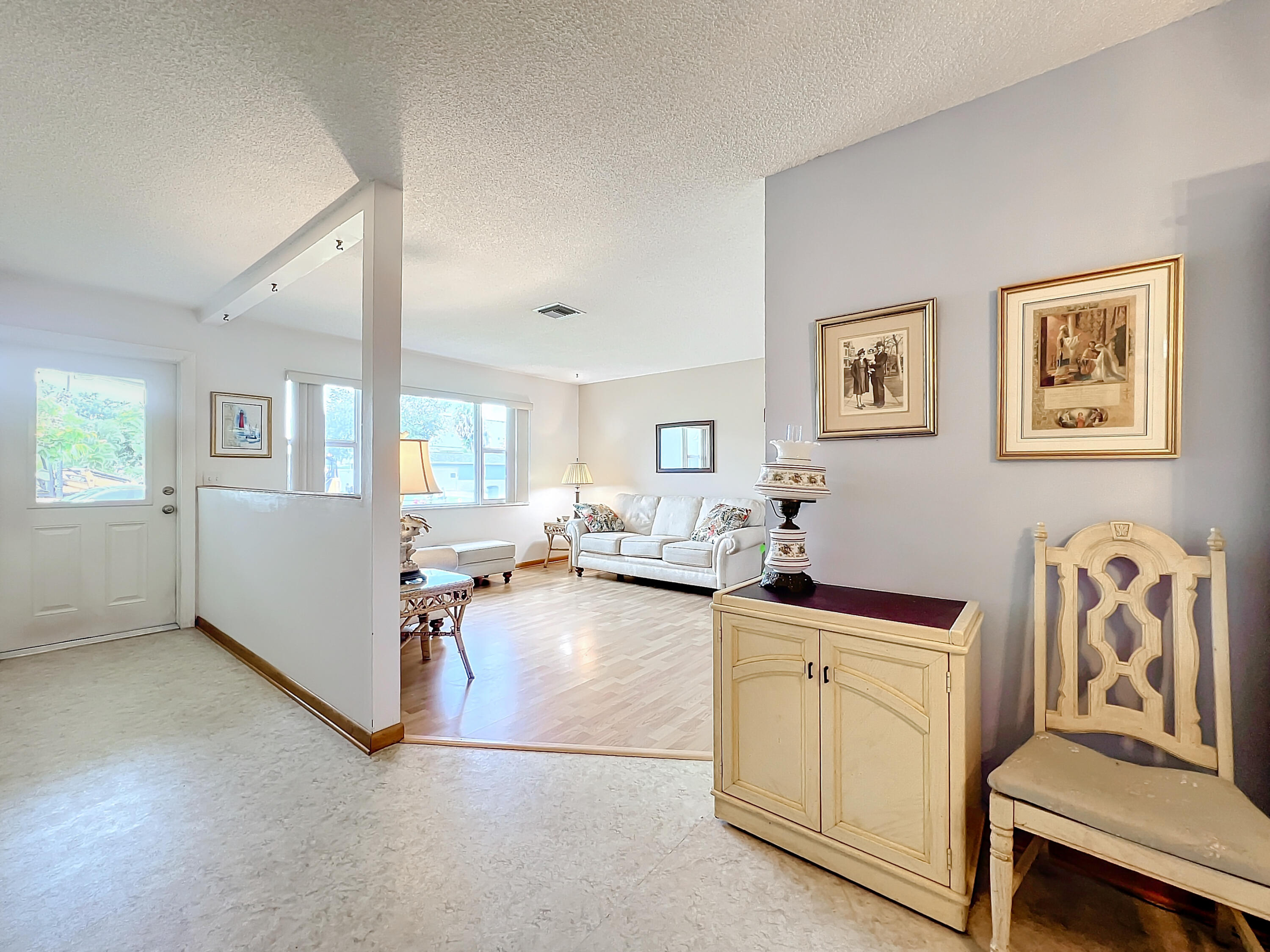 502 Circle East Jupiter, FL 33458 - Photo 6 of 55 a living room with furniture and a window