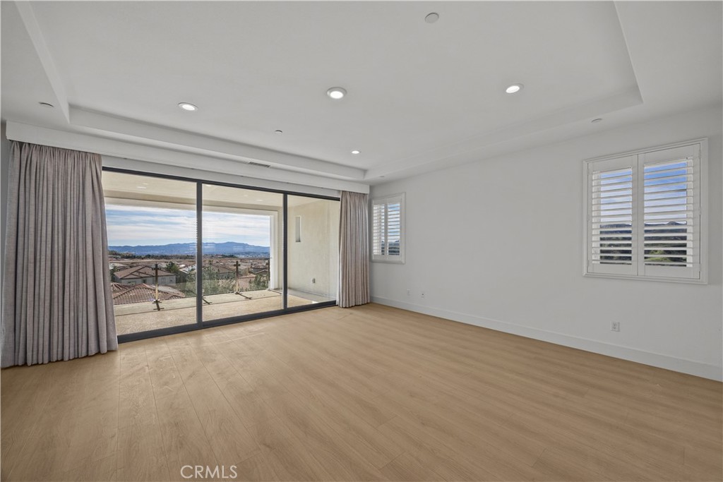 20638 Deer Grass Court Porter Ranch, CA 91326 - Photo 26 of 50 an empty room with large windows