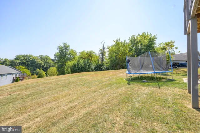 a view of a swimming pool with an outdoor space and seating area
