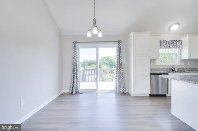 a view of a kitchen with a sink and a window