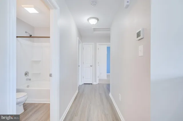 a view of a bathroom from the hallway