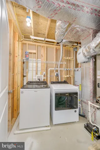 a living room with a fireplace furniture and a ceiling fan