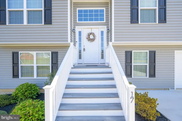 a view of a building with entryway and windows