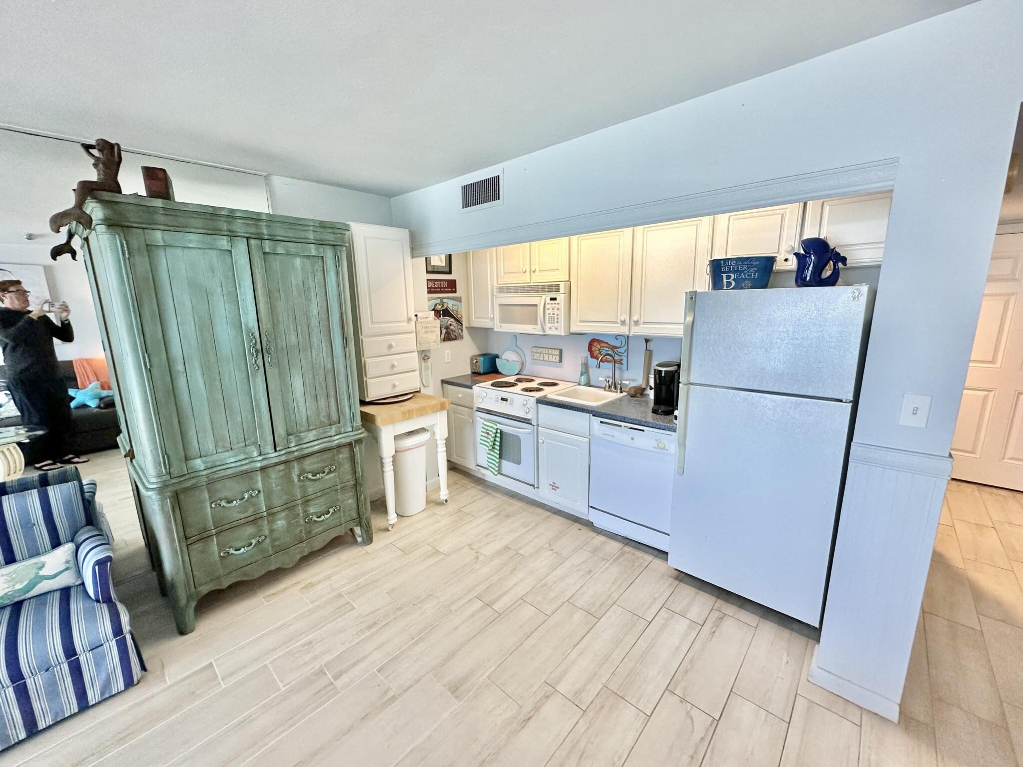 4280 Beachside 2, Unit 280 Miramar Beach, FL 32550 - Photo 10 of 34 a kitchen with a refrigerator a sink and dishwasher