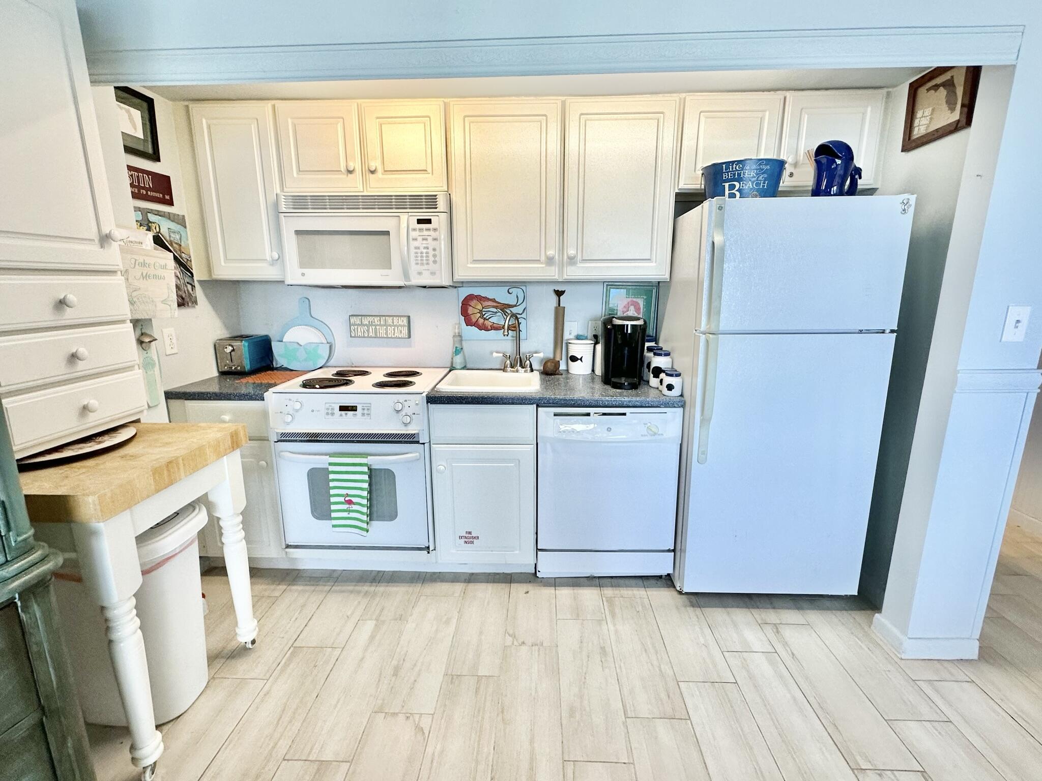 4280 Beachside 2, Unit 280 Miramar Beach, FL 32550 - Photo 13 of 34 a utility room with cabinets washer and dryer