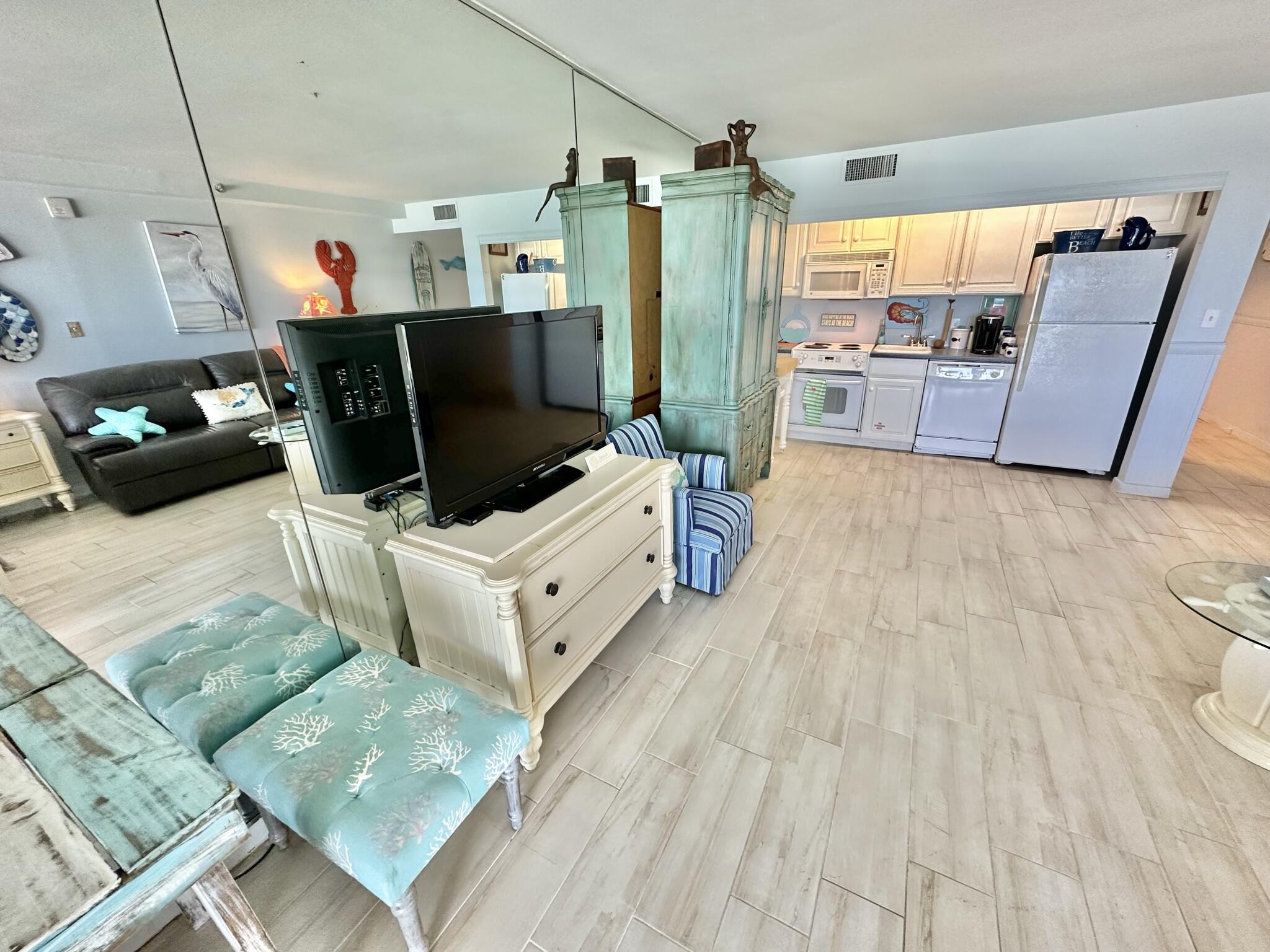4280 Beachside 2, Unit 280 Miramar Beach, FL 32550 - Photo 14 of 34 a living room with furniture and a flat screen tv
