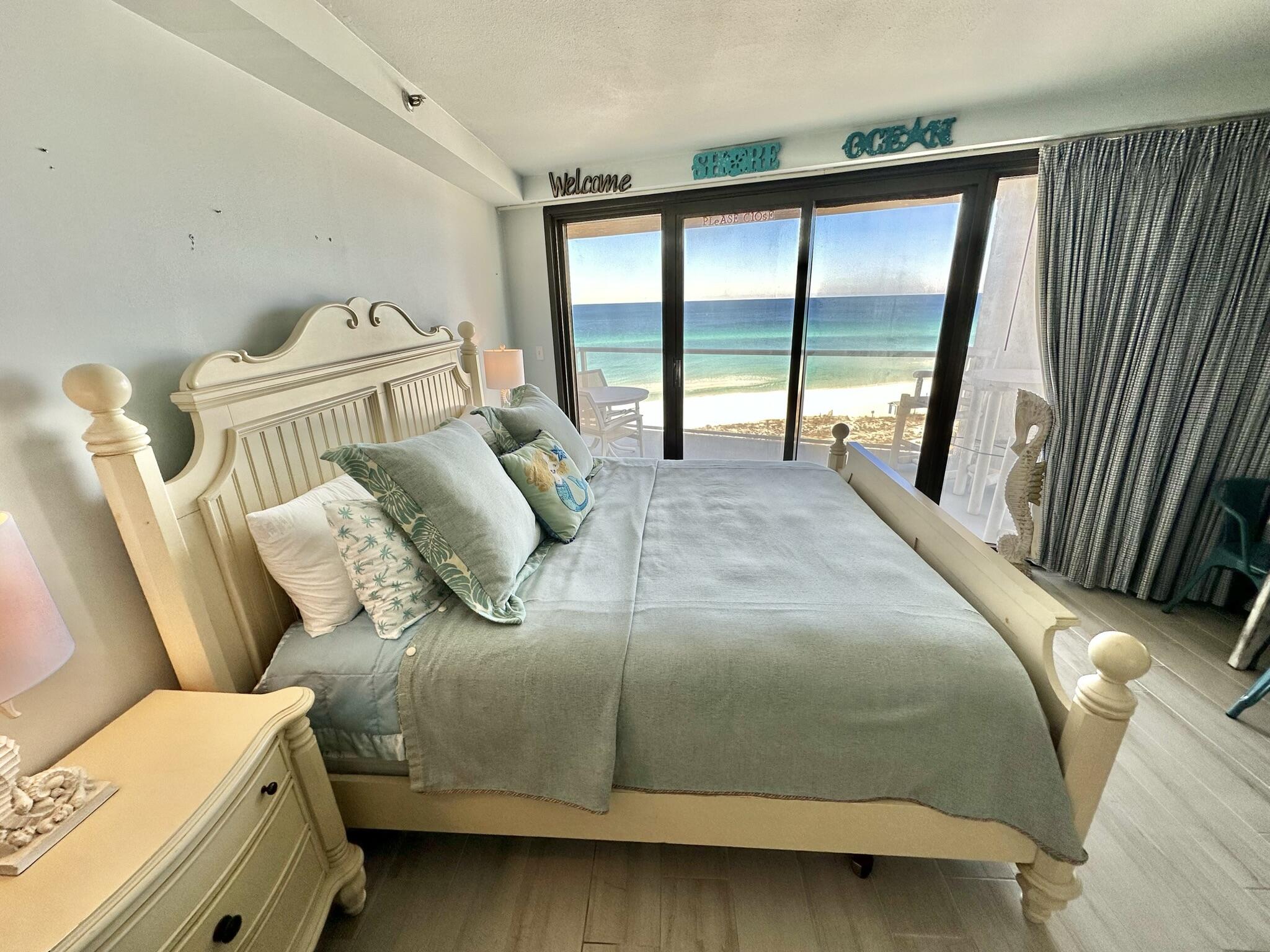 4280 Beachside 2, Unit 280 Miramar Beach, FL 32550 - Photo 16 of 34 a bedroom with a bed and a large window