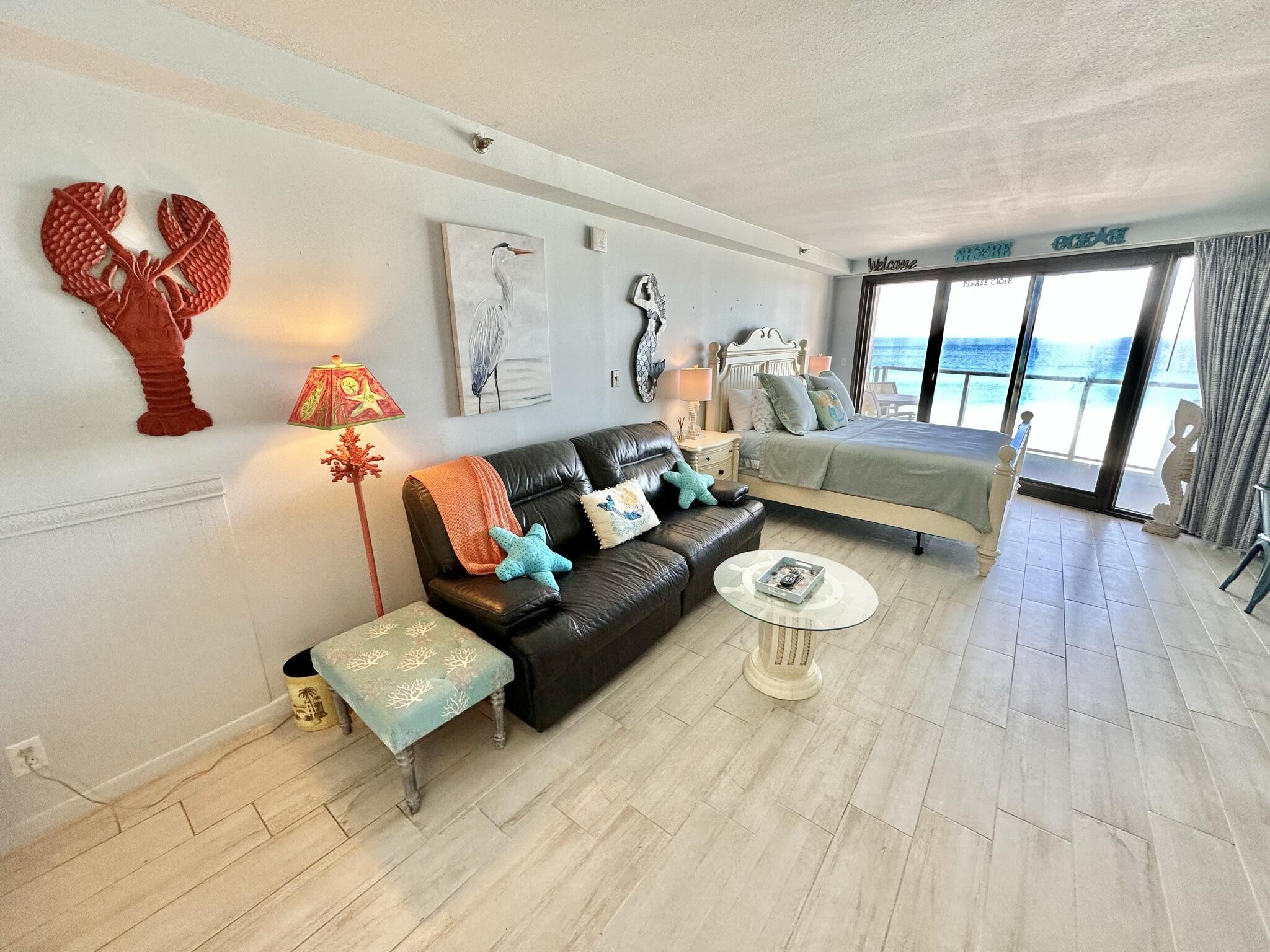 4280 Beachside 2, Unit 280 Miramar Beach, FL 32550 - Photo 23 of 34 a living room with furniture and a wooden floor