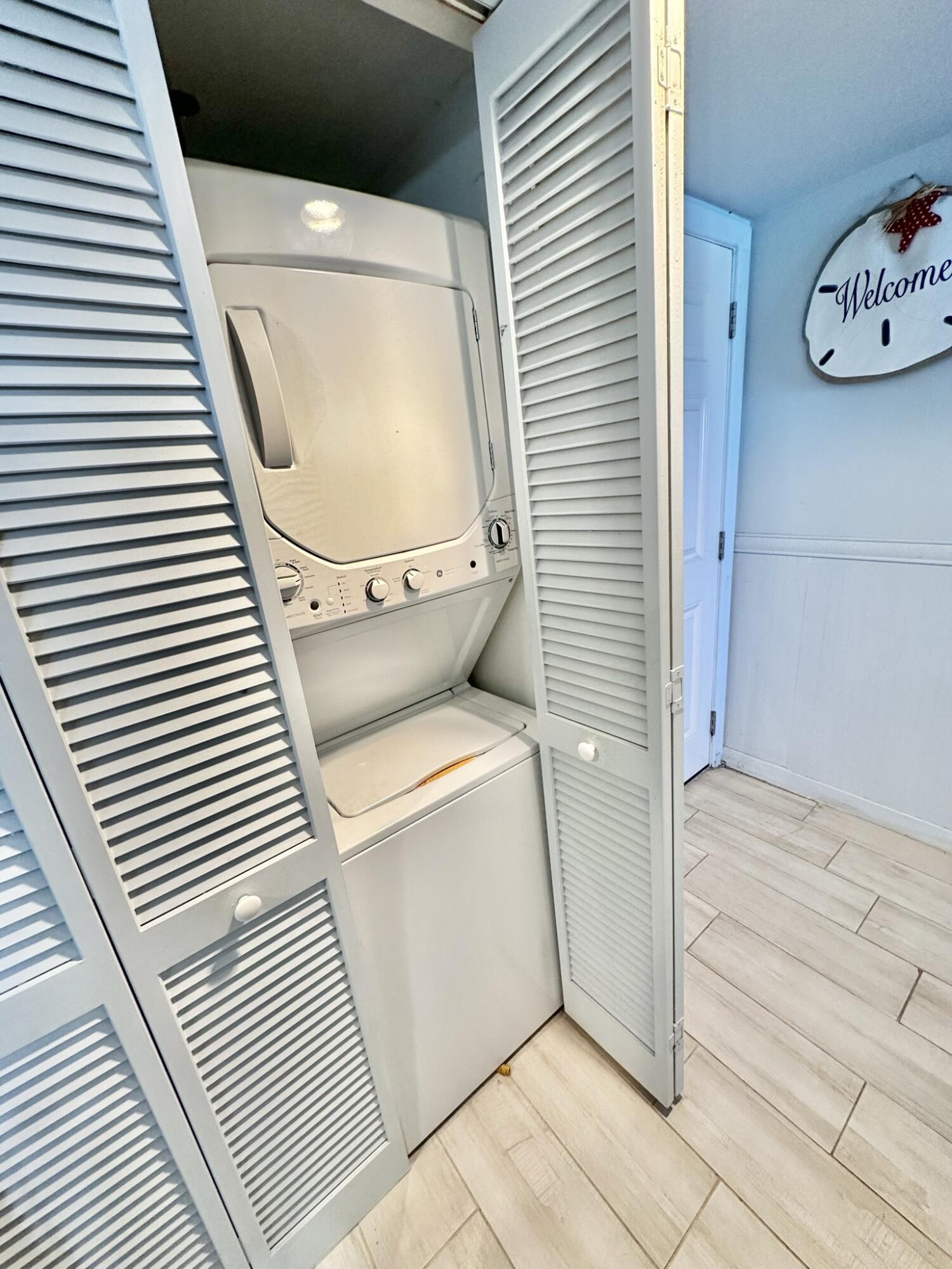 4280 Beachside 2, Unit 280 Miramar Beach, FL 32550 - Photo 24 of 34 a utility room with dryer and washer