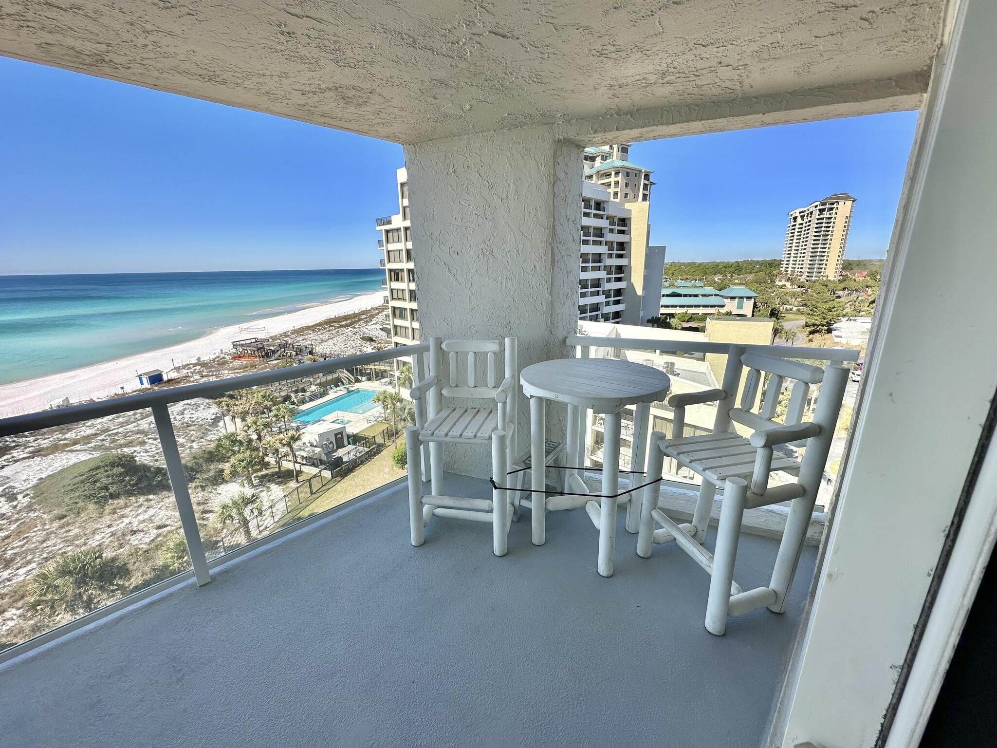 4280 Beachside 2, Unit 280 Miramar Beach, FL 32550 - Photo 28 of 34 a dining room with furniture and a floor to ceiling window