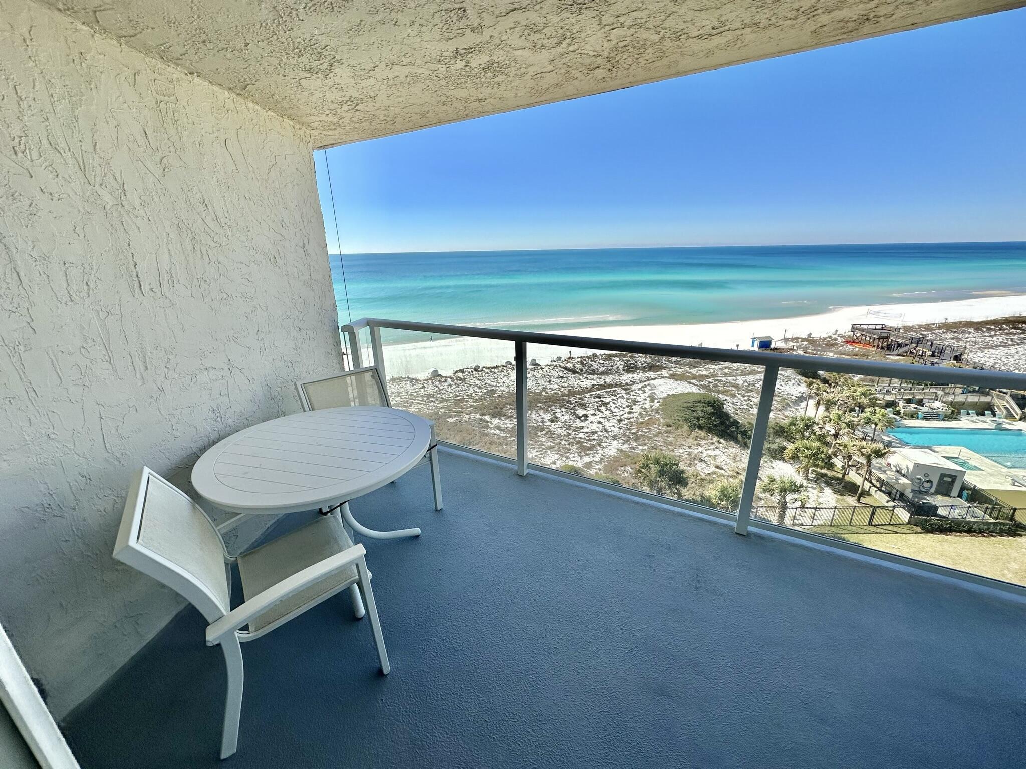 4280 Beachside 2, Unit 280 Miramar Beach, FL 32550 - Photo 29 of 34 a view of a chairs and table in patio
