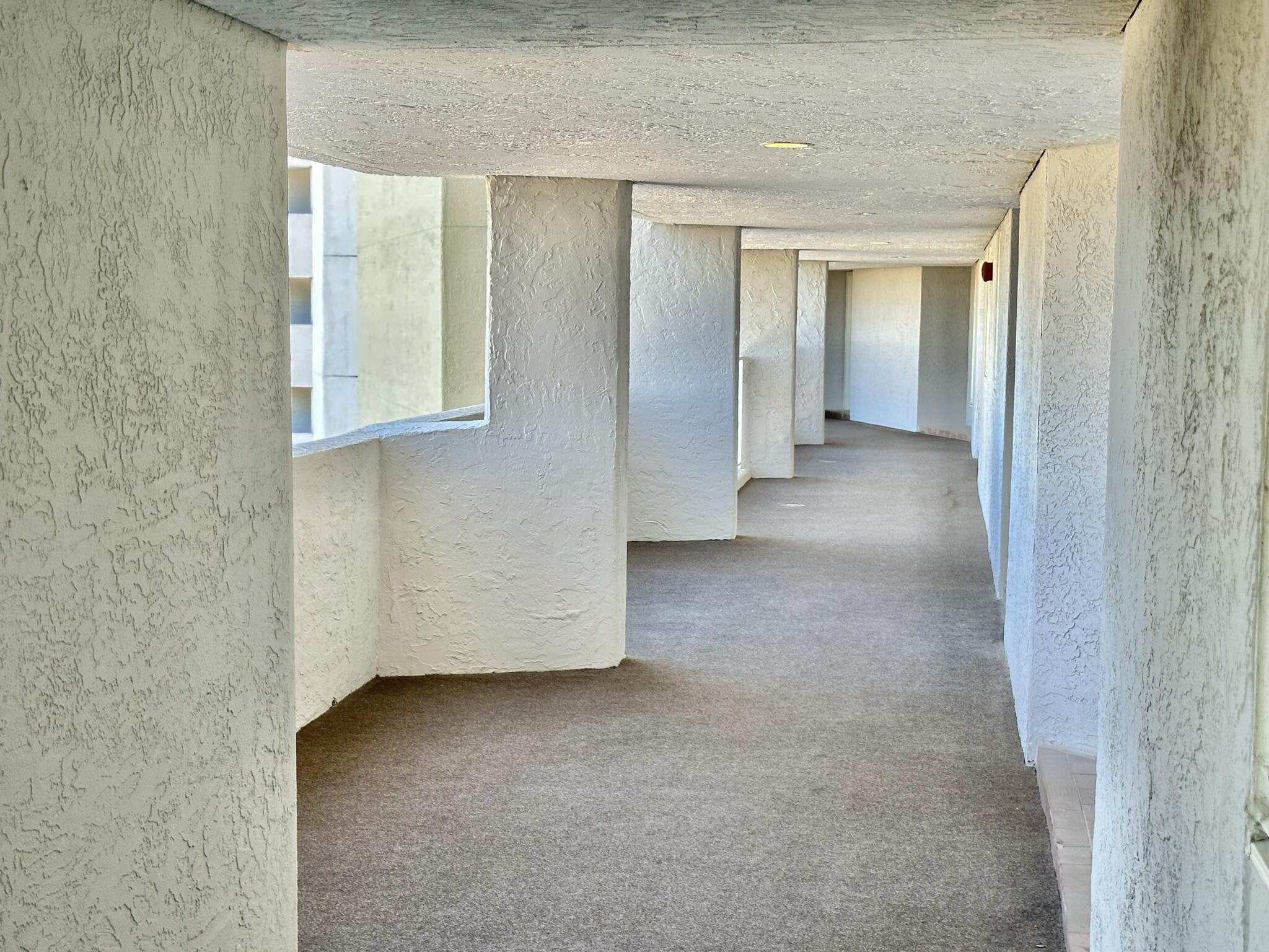 4280 Beachside 2, Unit 280 Miramar Beach, FL 32550 - Photo 33 of 34 a view of a hallway with wooden shelves
