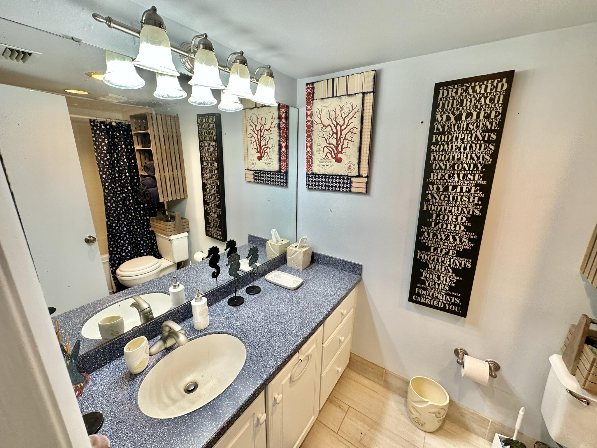 4280 Beachside 2, Unit 280 Miramar Beach, FL 32550 - Photo 3 of 34 a bathroom with a sink mirror and vanity