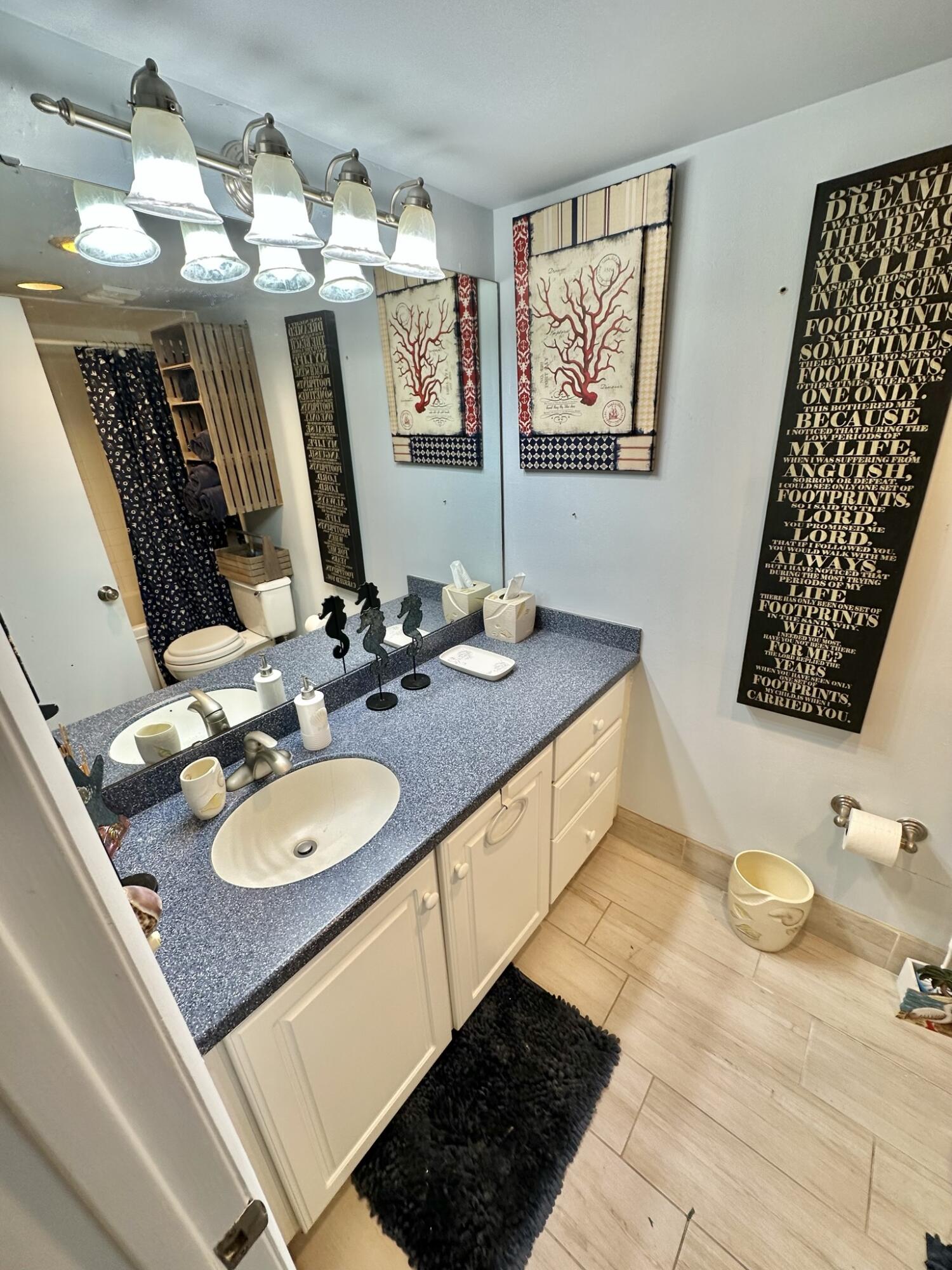 4280 Beachside 2, Unit 280 Miramar Beach, FL 32550 - Photo 4 of 34 a bathroom with a granite countertop sink and a mirror