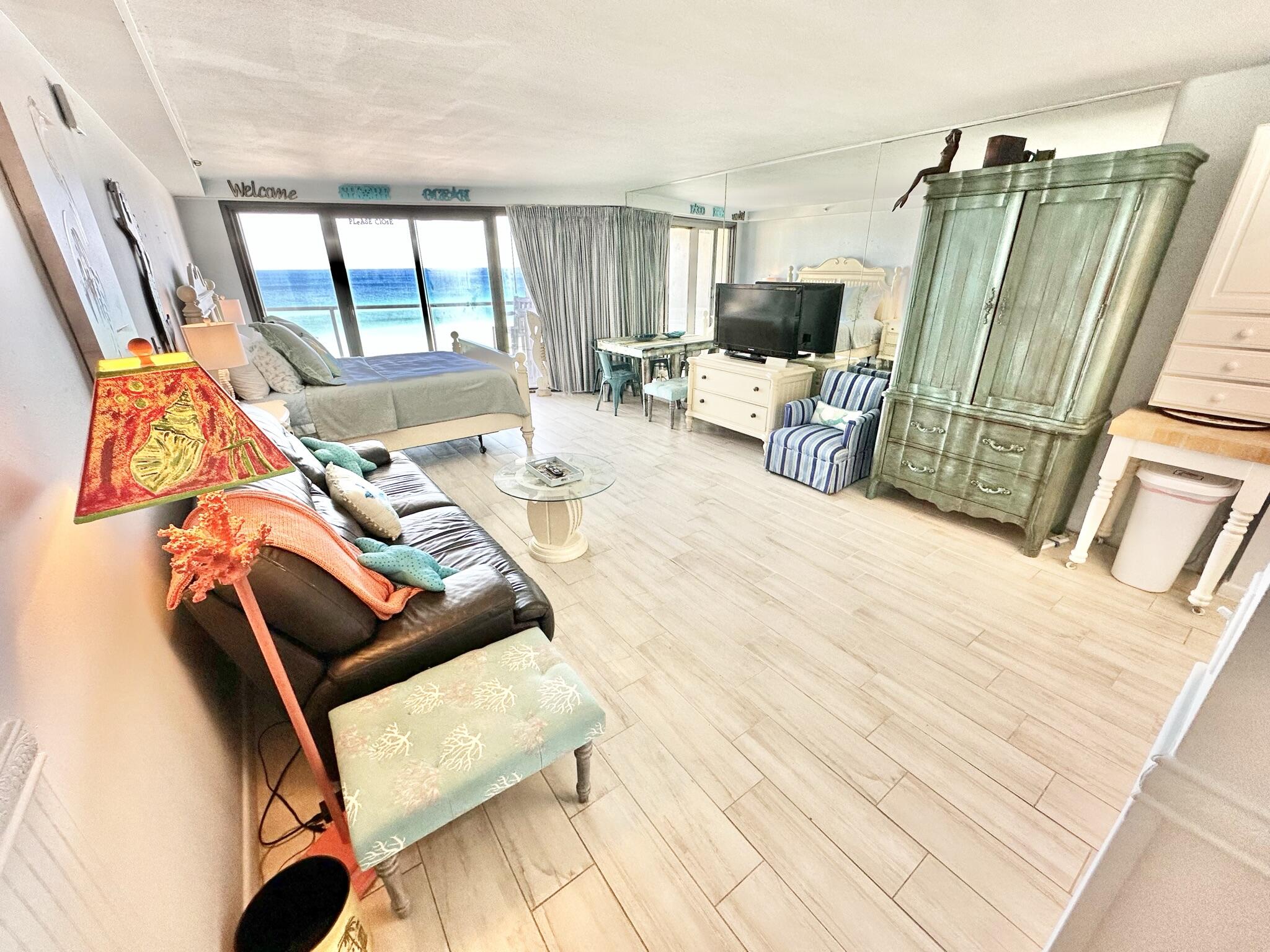 4280 Beachside 2, Unit 280 Miramar Beach, FL 32550 - Photo 6 of 34 a view of a living room with furniture and a flat screen tv